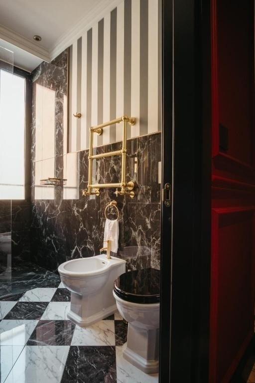 a bathroom with black and white stripes on the wall