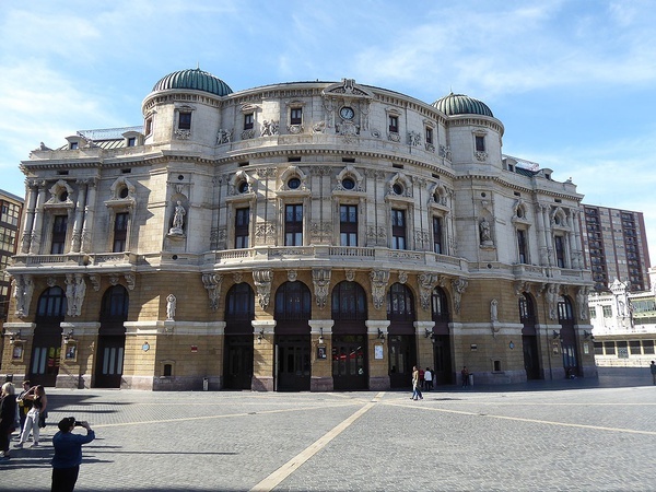 a large building with a clock on the top of it