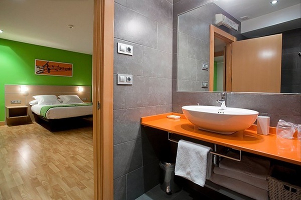 a bathroom with an orange counter top and a sink