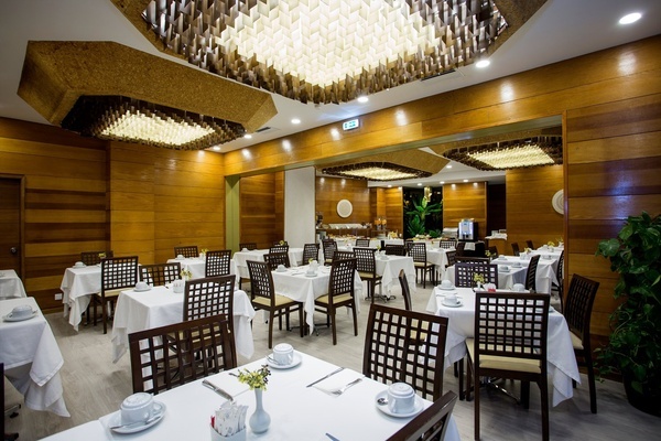 a restaurant with tables and chairs and a sign that says exit