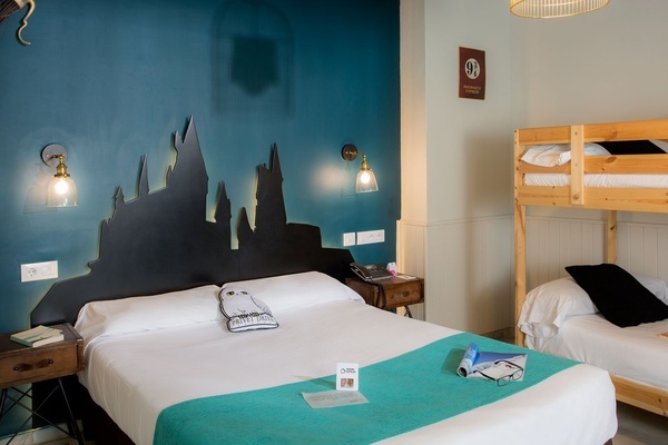 a bedroom with a bunk bed and a sign that says platform 9 3/4
