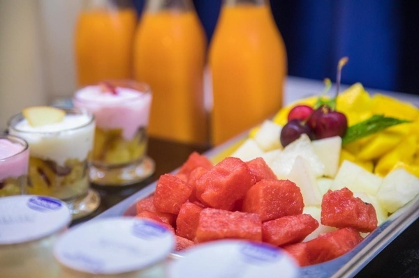 a tray of fruit including watermelon and pineapple