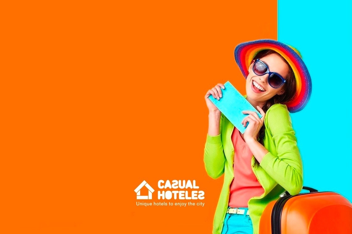 a woman holding a passport and a suitcase in front of an orange and blue background that says casual hotels