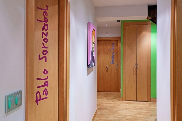 a hallway with a door that says bello sorazabal on it