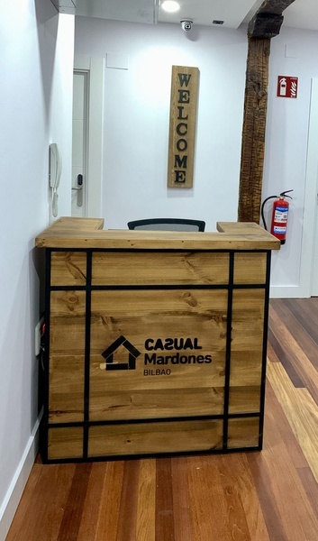 a wooden reception desk for casual mardones bilbao