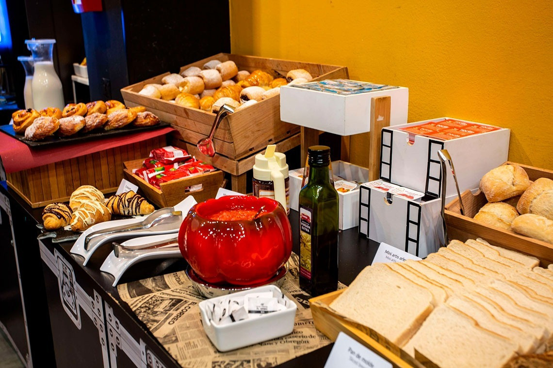 a buffet table with a bottle of ketchup on it