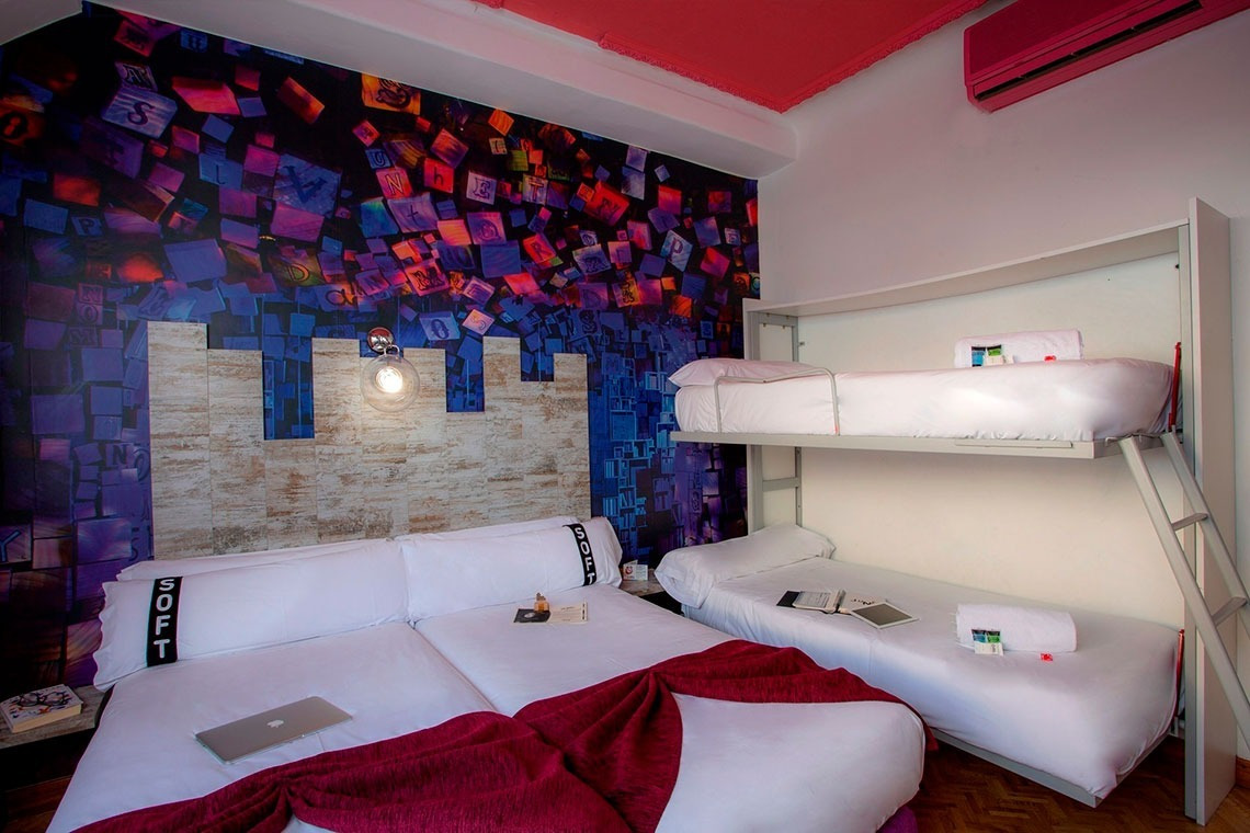 a bedroom with a bunk bed and a pillow that says ' south ' on it