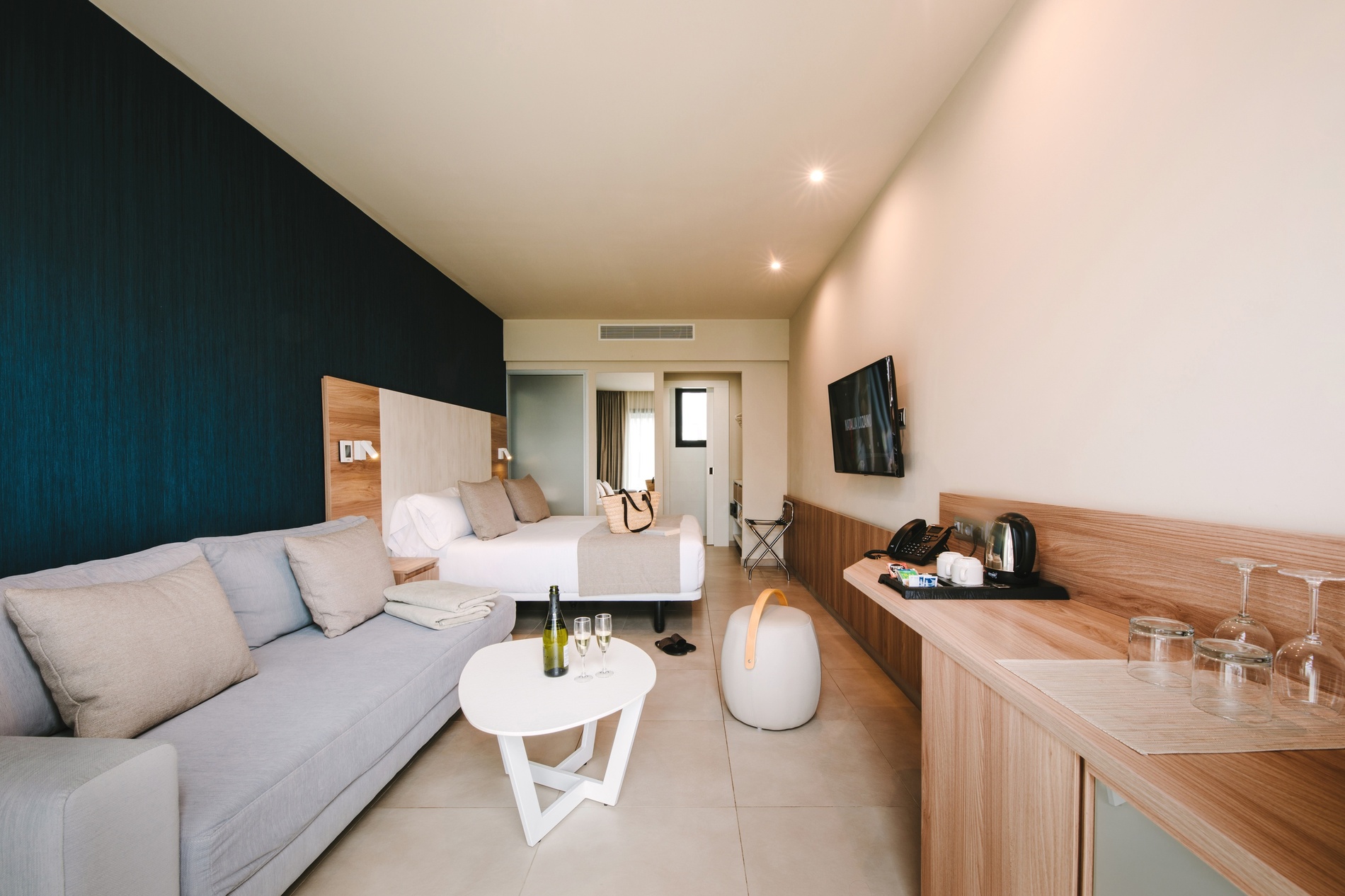 Modern Club Maspalomas suite with king bed and balcony view.