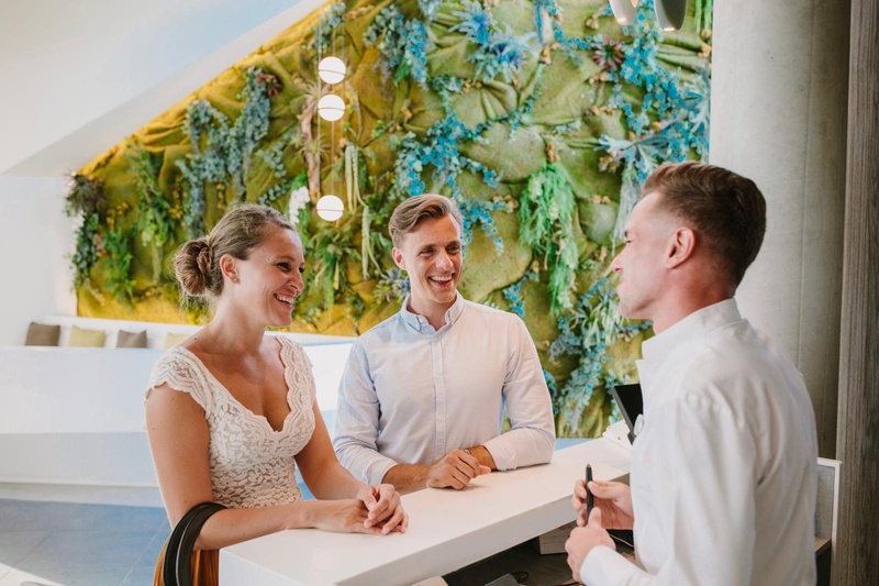 Modern reception at Club Maspalomas with natural decor.