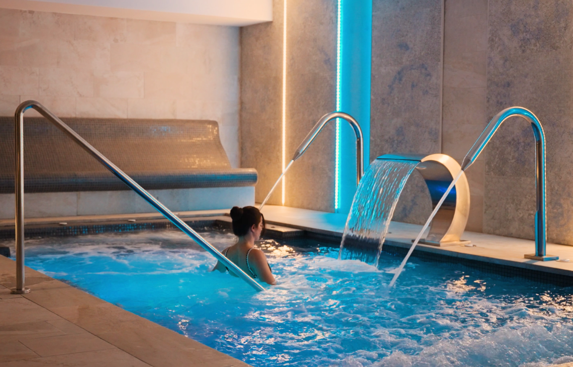 Relax in the HTOP: Cocoon Spa spa pool with soothing water features and ambient lighting.