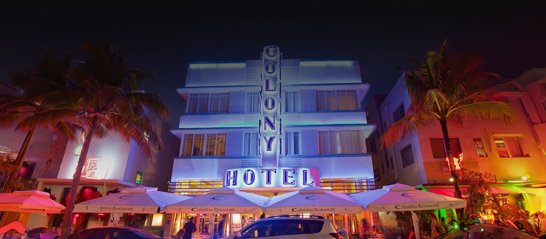 the colony hotel is lit up at night