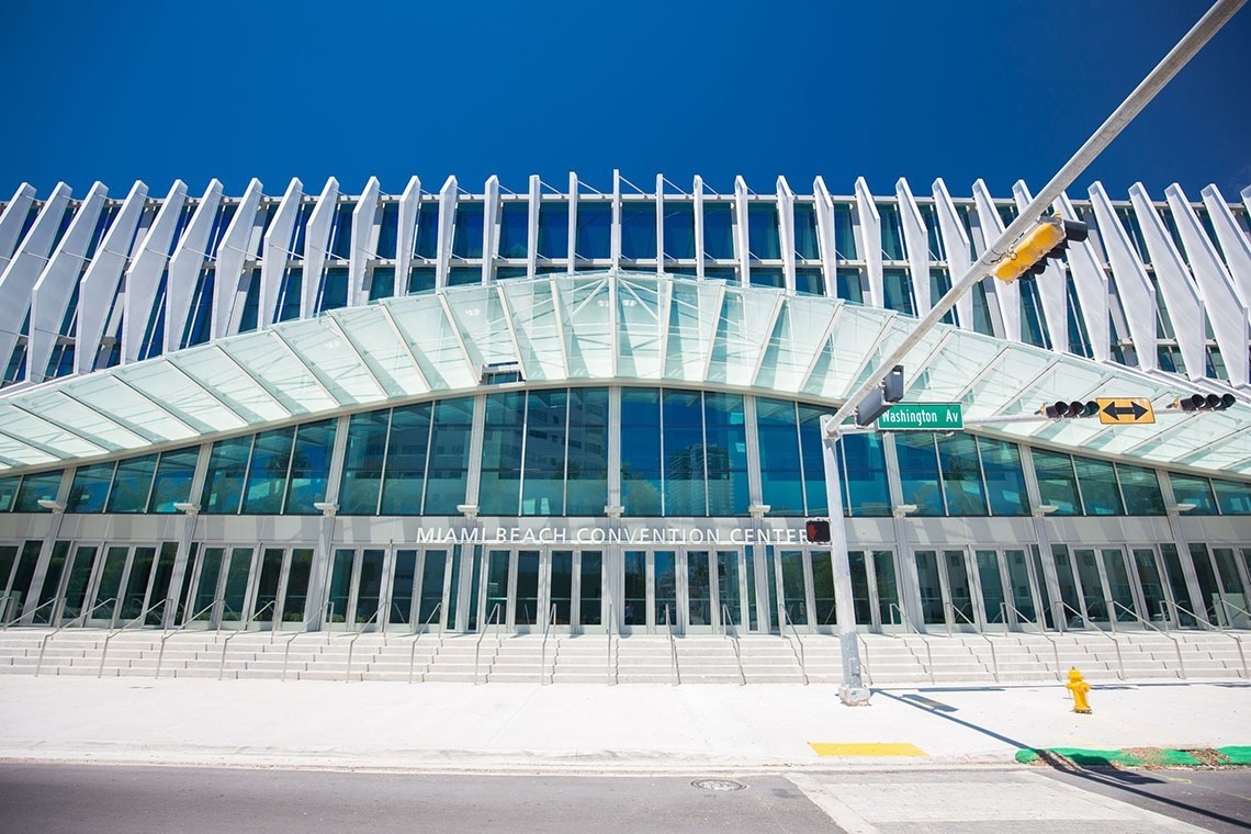 the miami beach convention center has a large glass facade