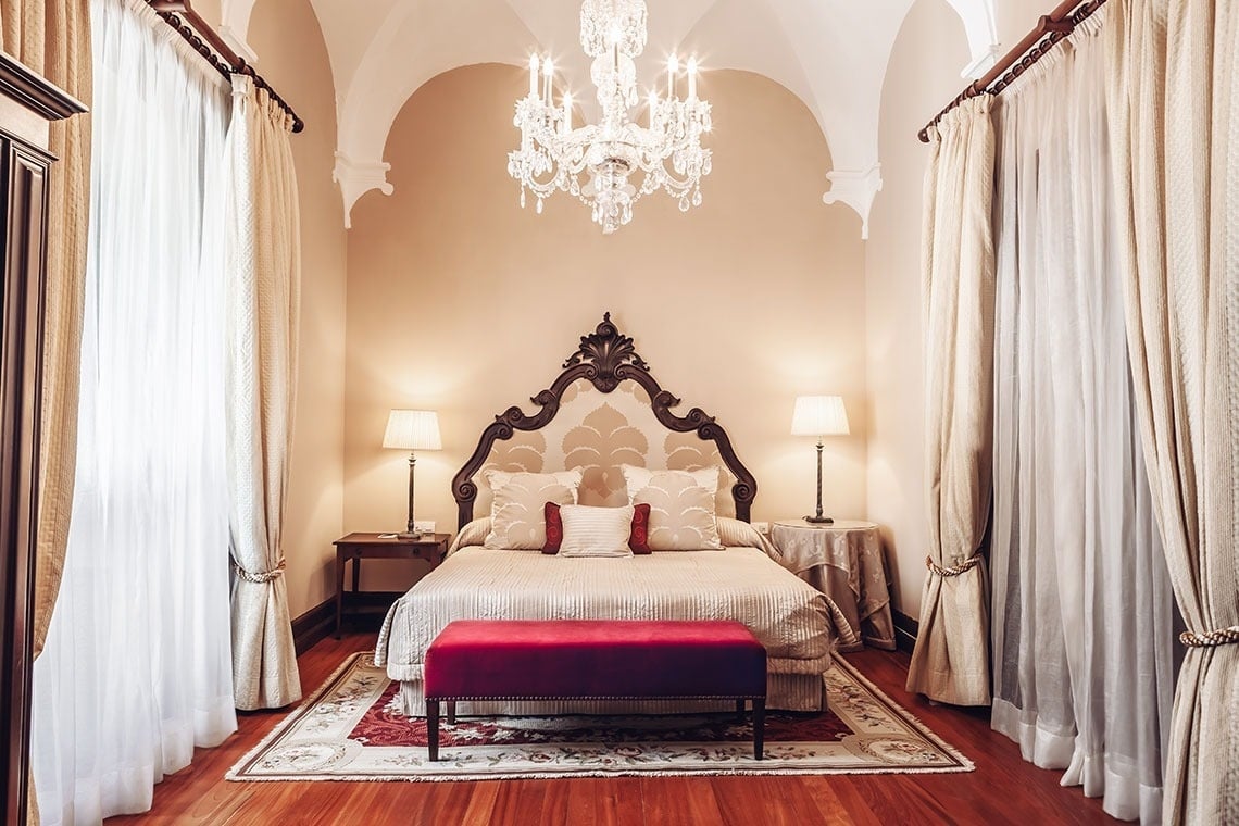 a hotel room with a large bed and a balcony