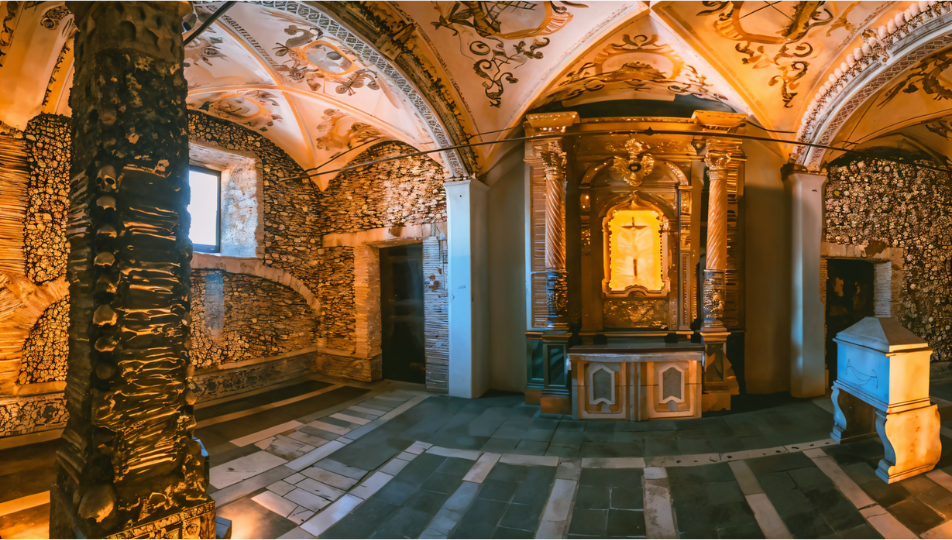 a room filled with bones and a cross on the wall