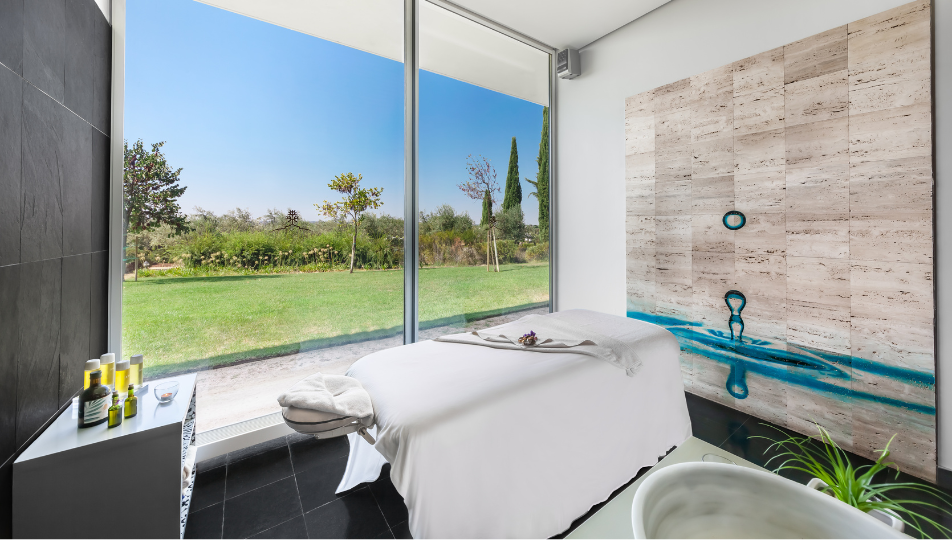 a massage table in a room with a large window