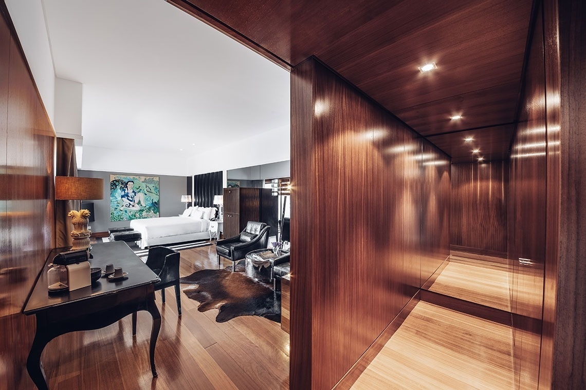 a hotel room with a large bed and a flat screen tv