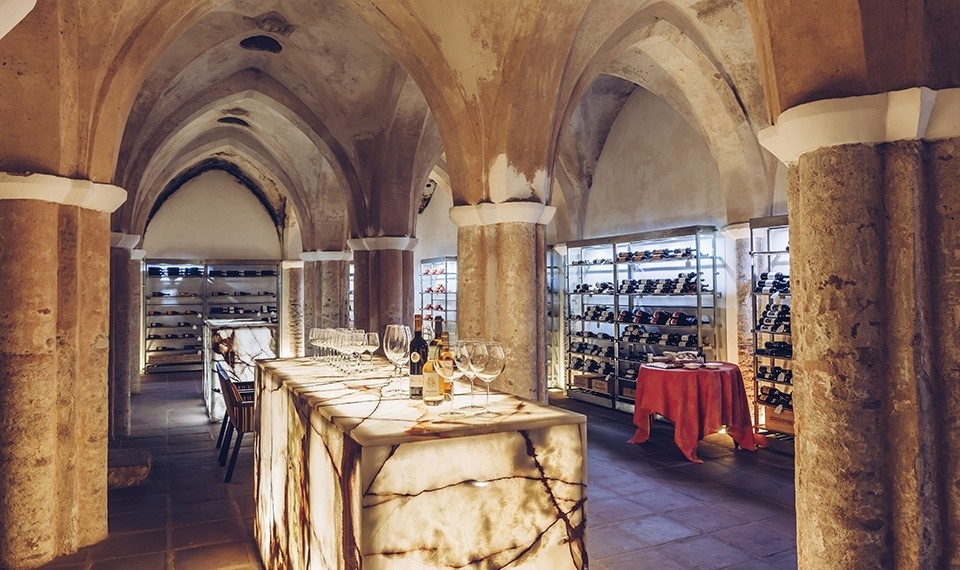 a bottle of conve espin wine is poured into a glass