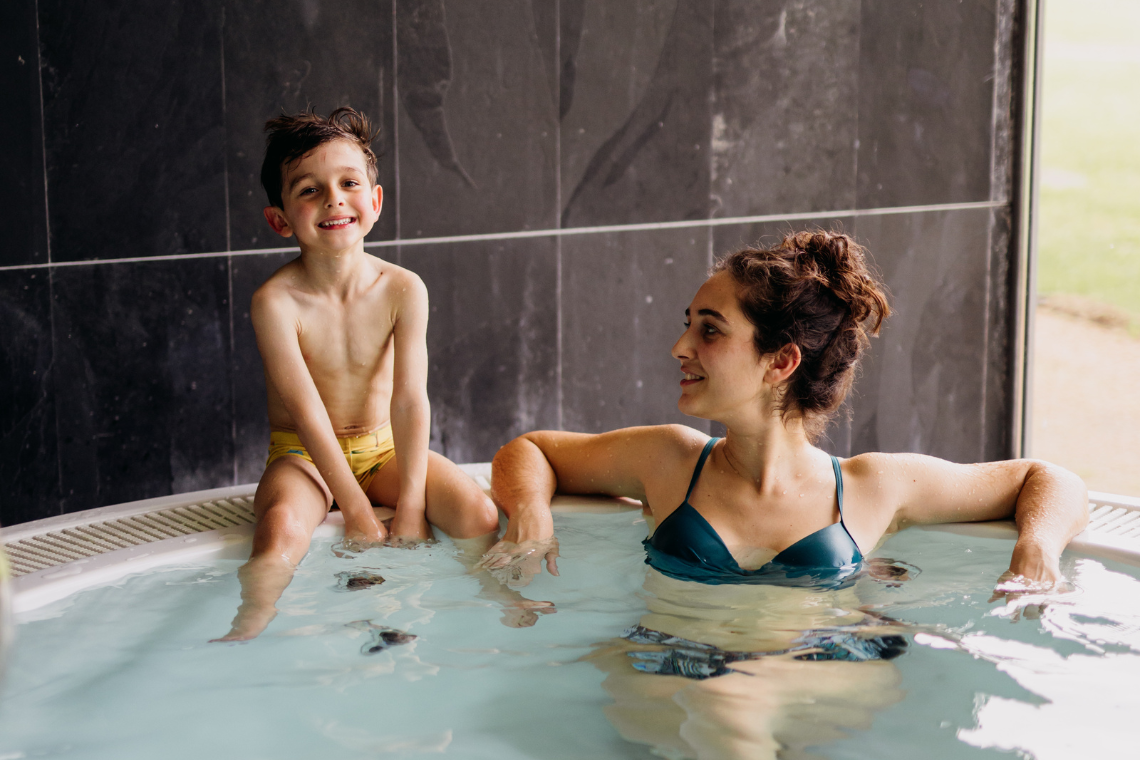 a woman getting her hair washed with a towel