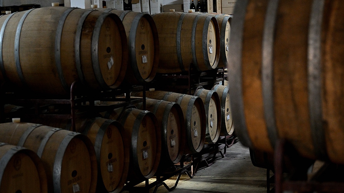 Wine barrels aging at Convento do Espinheiro, a luxury hotel.