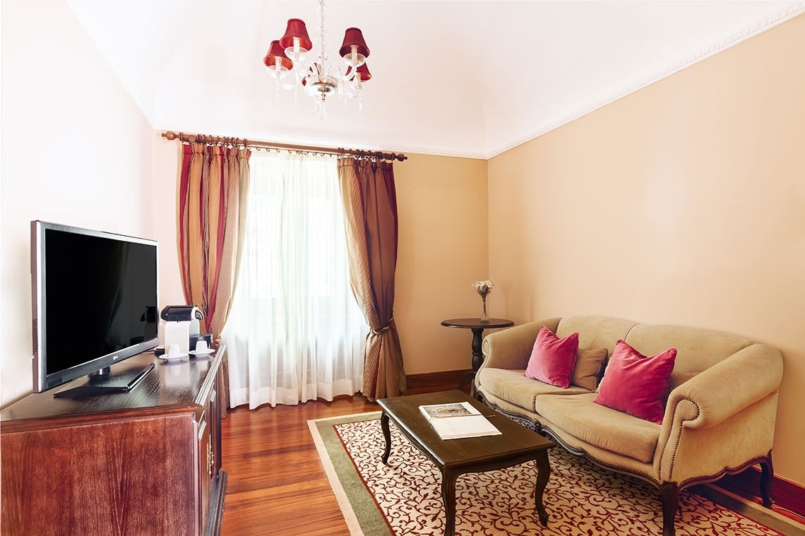 a hotel room with a large bed and a balcony