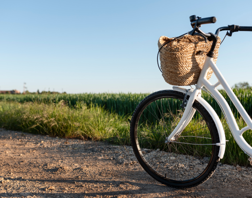 a woman is sitting on a couch holding a piece of embroidered fabric .