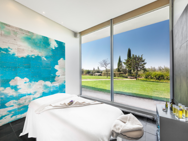 a large white building with a blue sky in the background