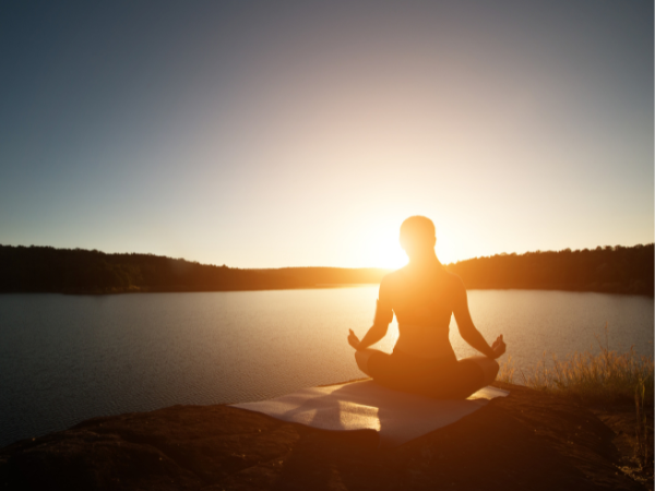 a slice of pizza is on a wooden cutting board