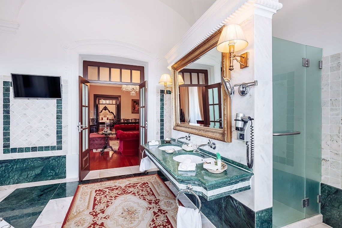 a hotel room with two beds and a large mirror