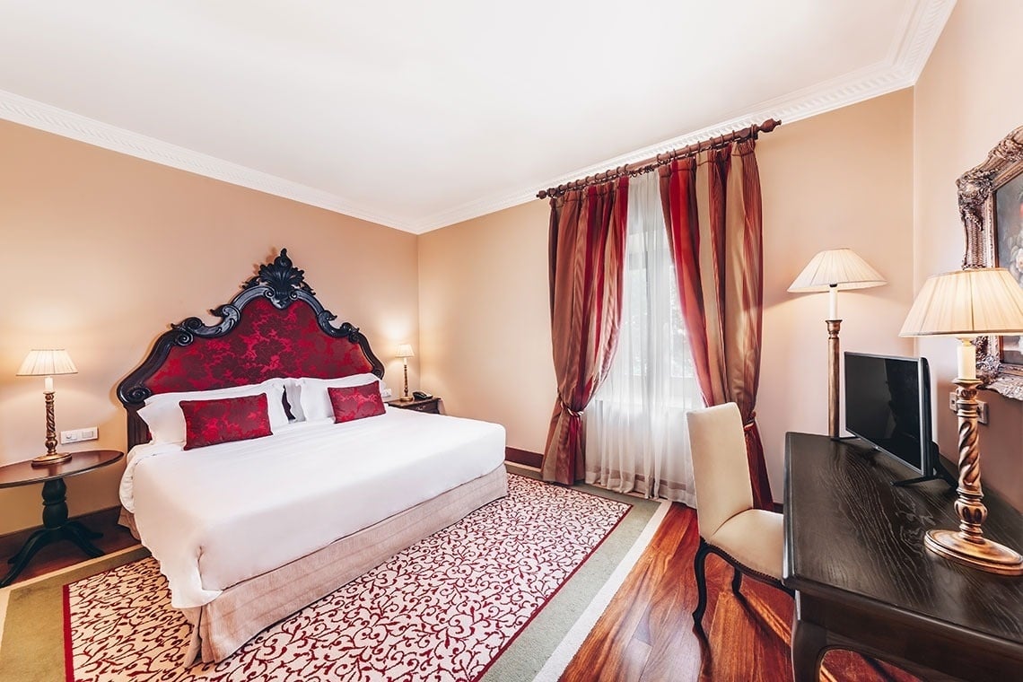 a hotel room with two beds and a bathroom