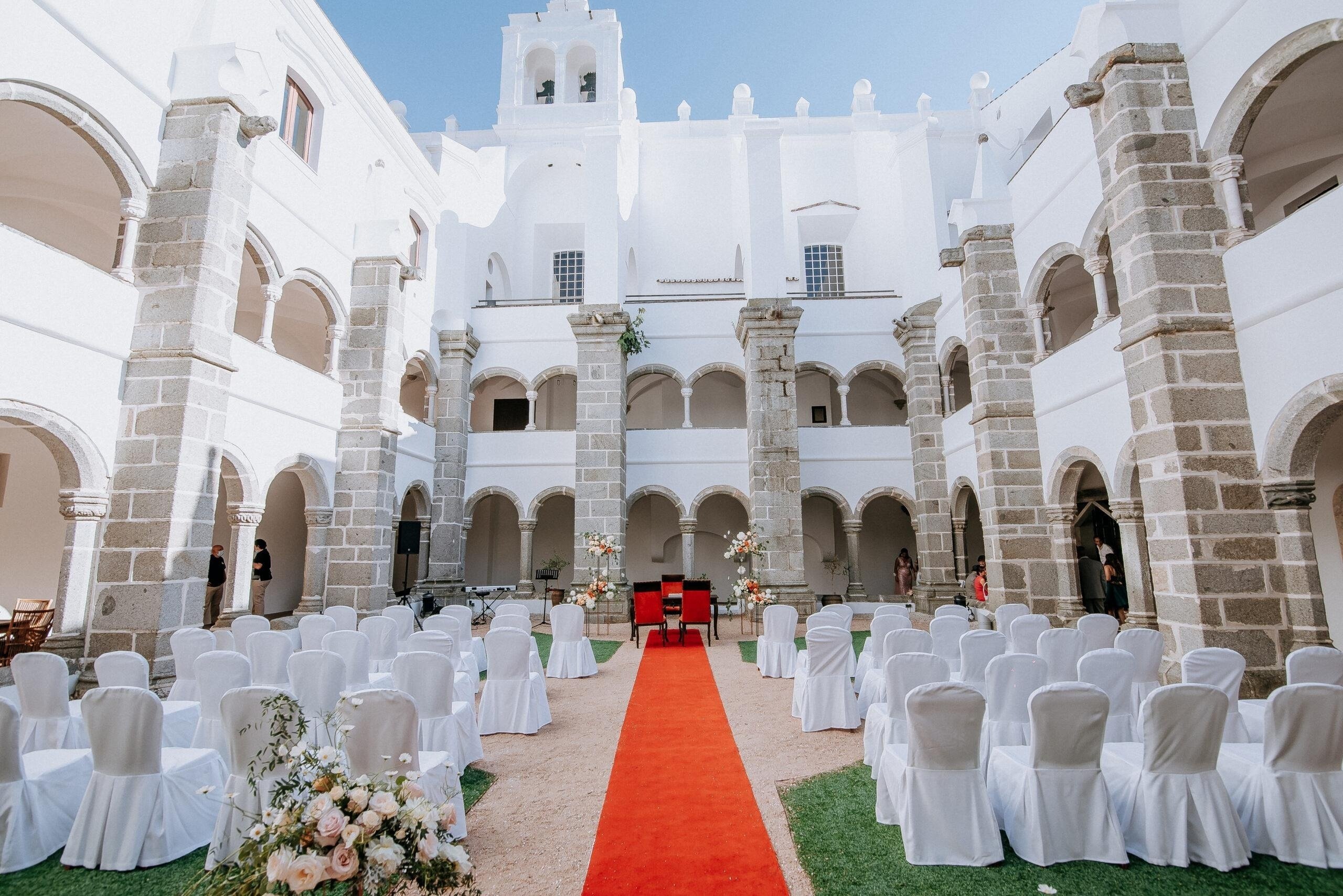 a library with a table and chairs and bookshelves
