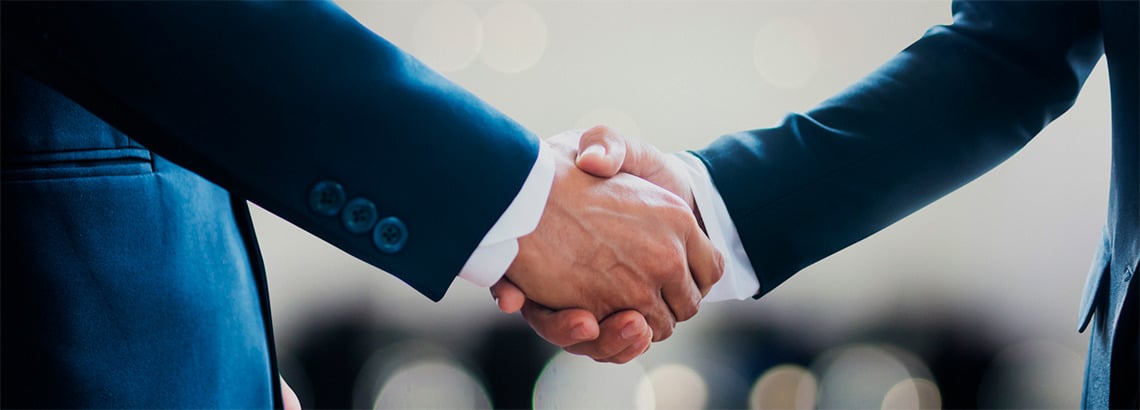 Successful business deal: Handshake at Meetings | Convento do Espinheiro, Historic Hotel & Spa.