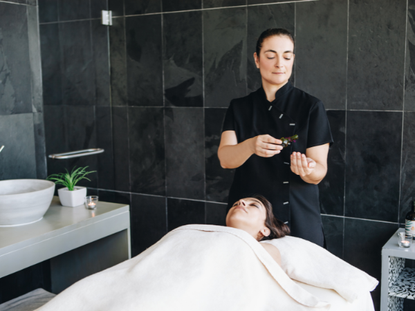 a slice of pizza is on a wooden cutting board
