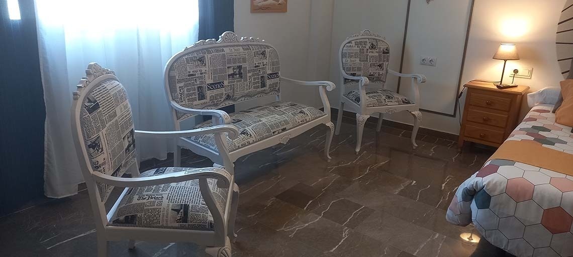 a chair with a newspaper pattern on it says ' new york times ' on it
