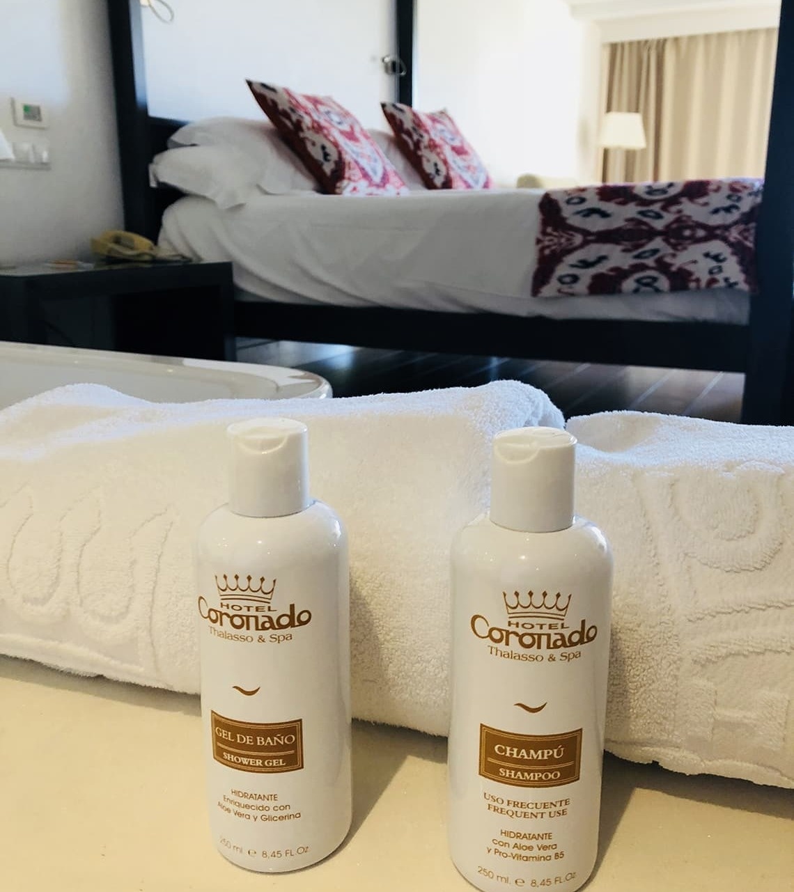 two bottles of hotel coronado shampoo and shower gel