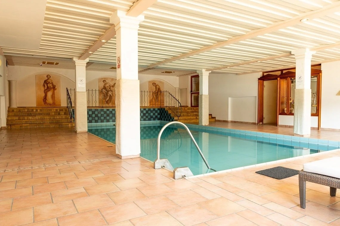a restaurant with tables and chairs and a large window