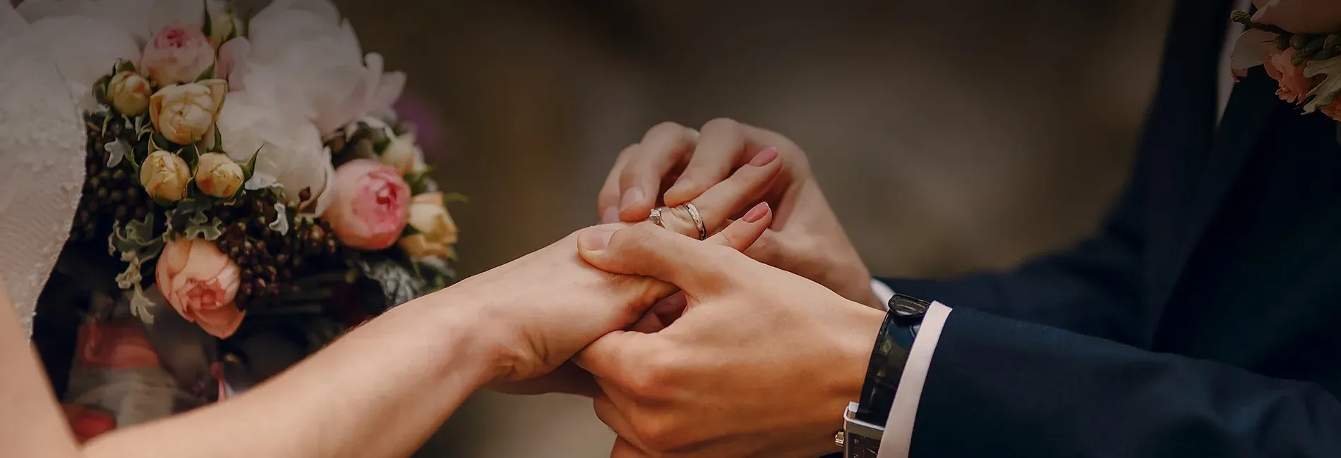 NEXTA Corporate Wedding: Exchanging rings with a floral bouquet.