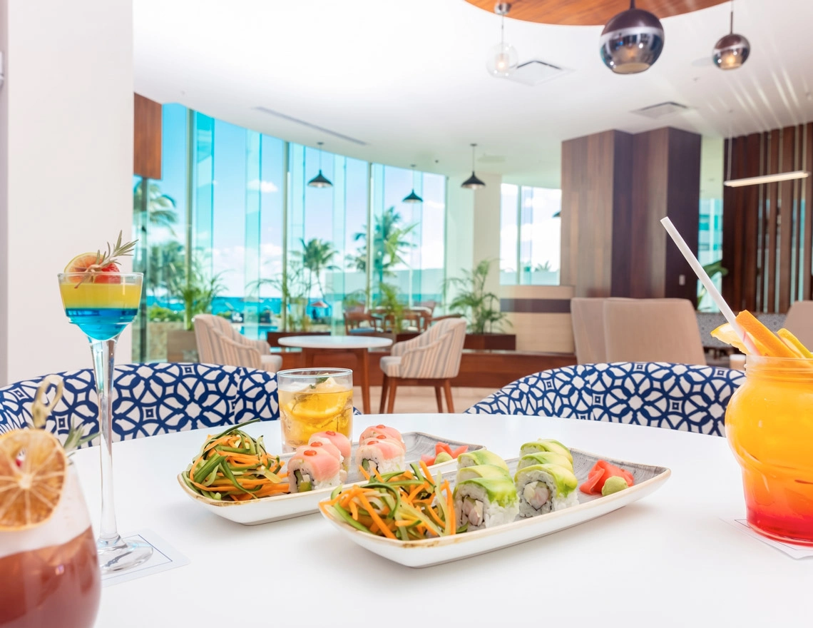 Sushi and tropical cocktails at a resort lounge. DEMO 3 ambiance.