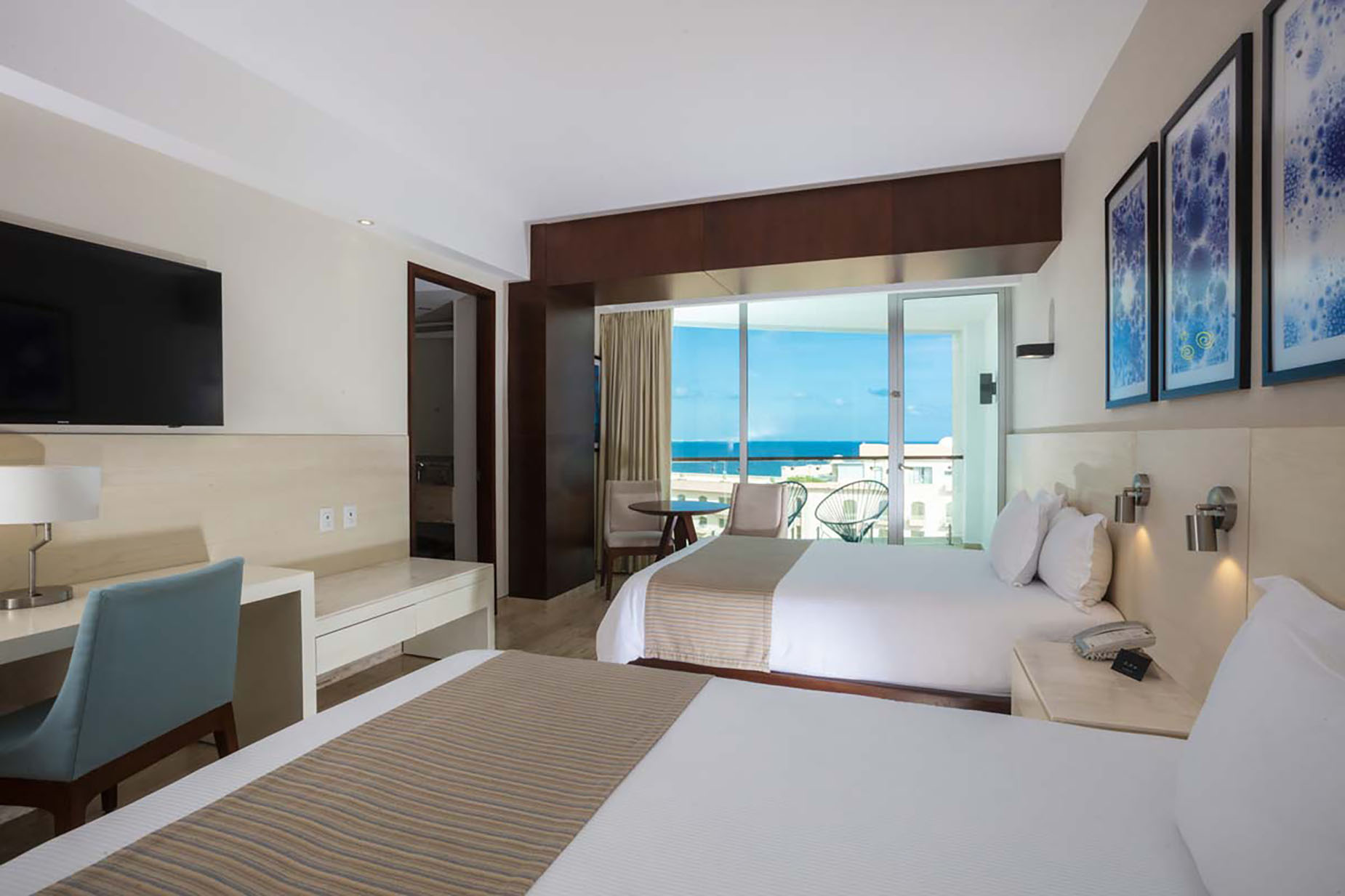 Hotel room with two beds and ocean view balcony DEMO 3