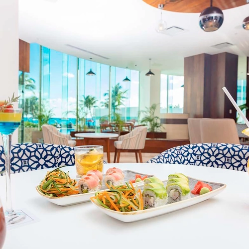 Enjoy colorful cocktails and sushi at our beachfront DEMO 3 lounge with ocean views.