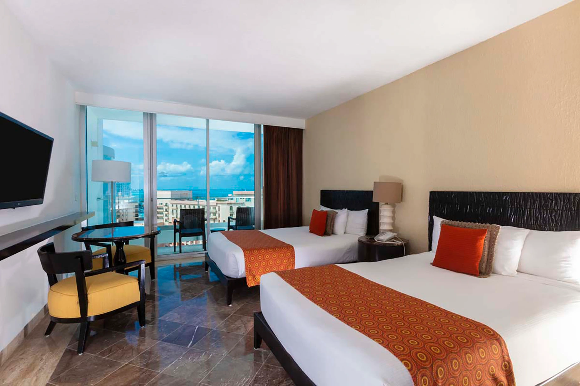 Comfortable hotel room with two beds and a balcony overlooking the ocean. DEMO 3