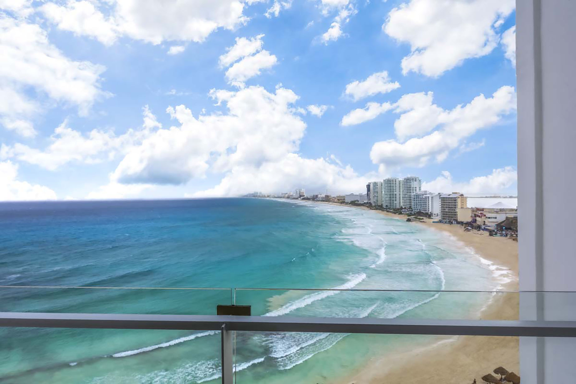Oceanfront hotel balcony view of Cancun's beaches and resorts DEMO 3