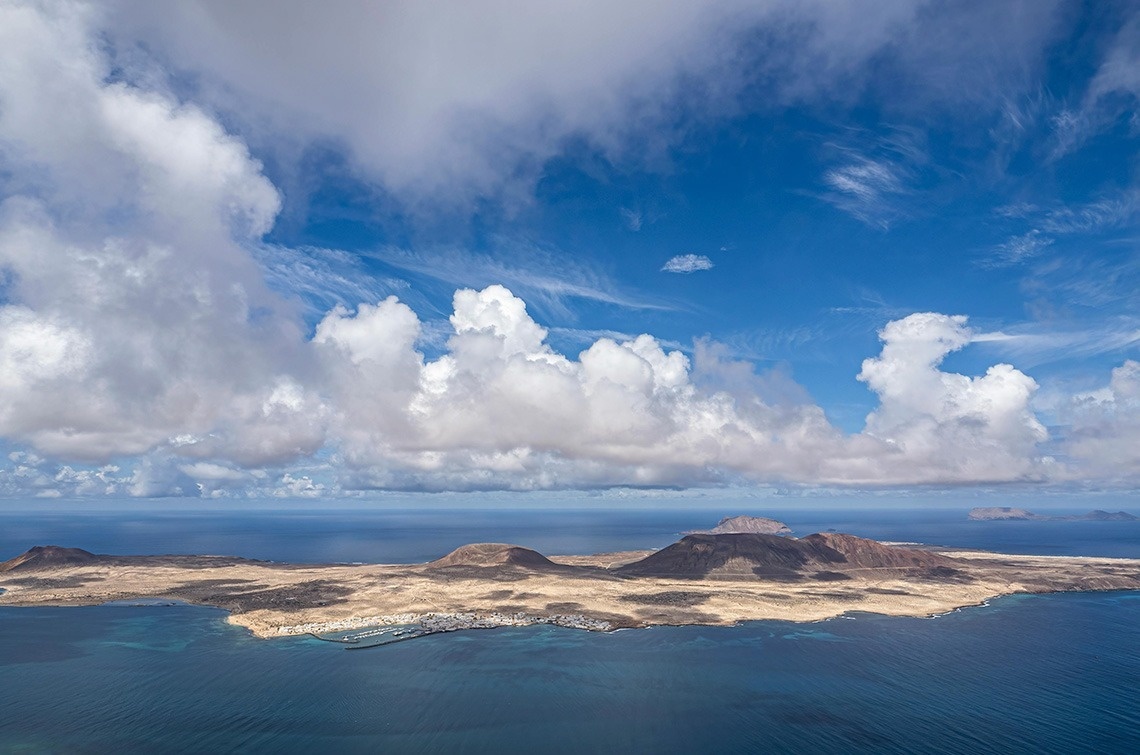 an aerial view of a small island in the middle of the ocean