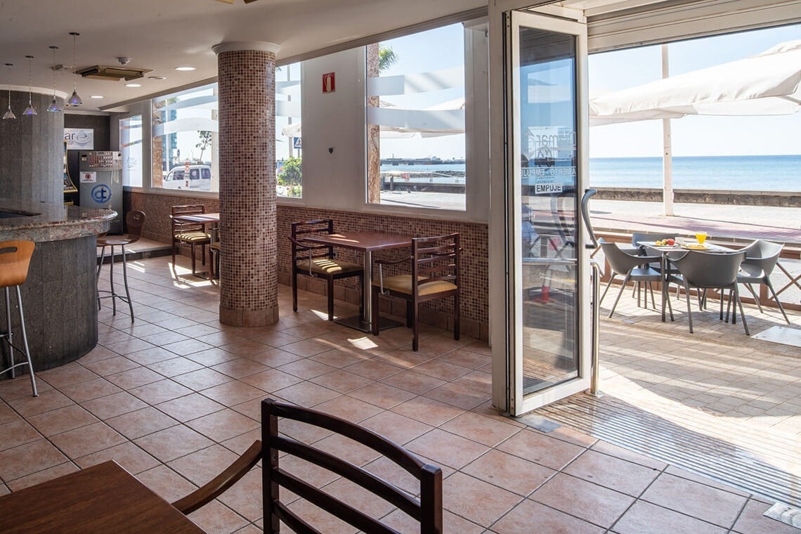a white plate topped with cooked octopus and green onions