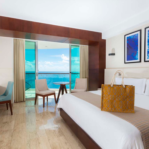 Hotel room with ocean view, desk, and a stylish DEMO 3.