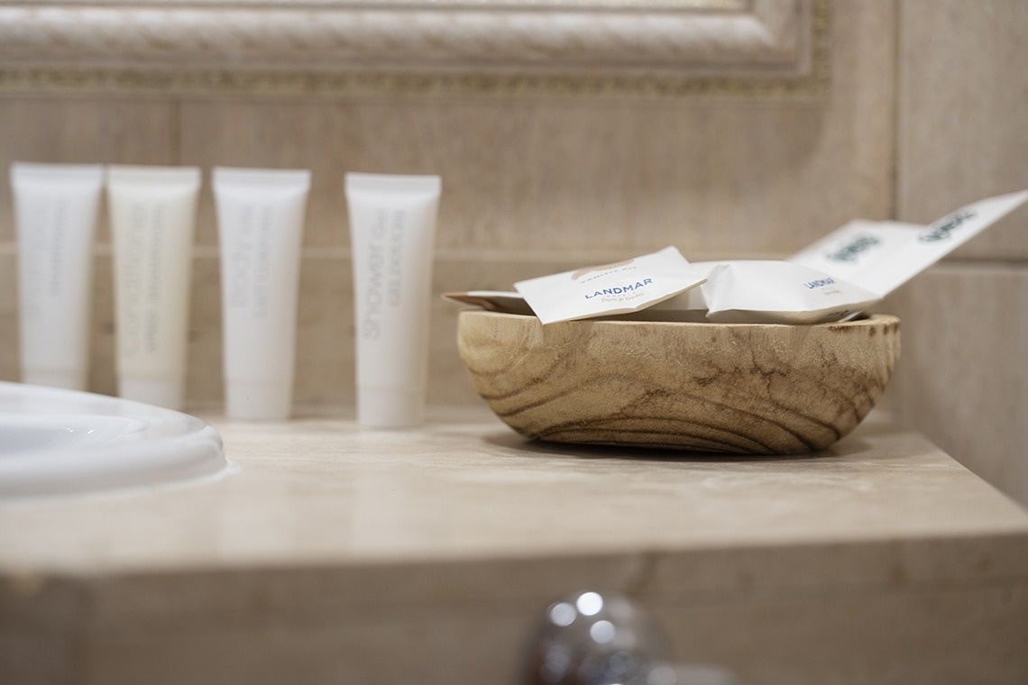 a bowl of landmark soap sits on a bathroom counter