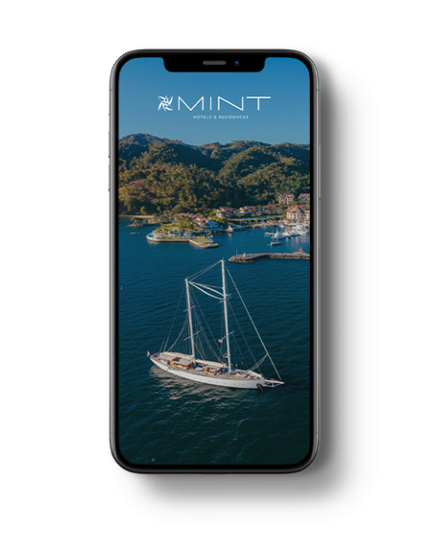 a phone with a picture of a bedroom on the screen