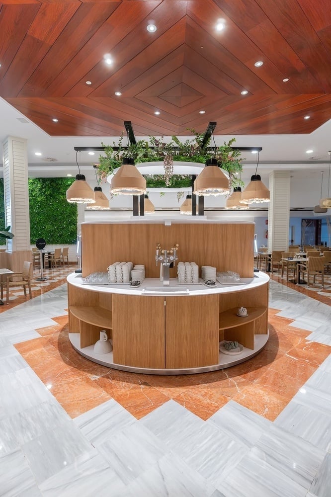 a buffet area in a restaurant with a wooden ceiling