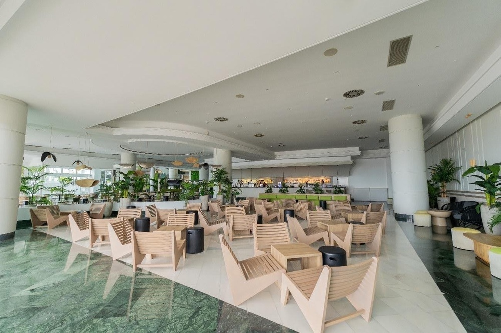 a large room with lots of chairs and tables