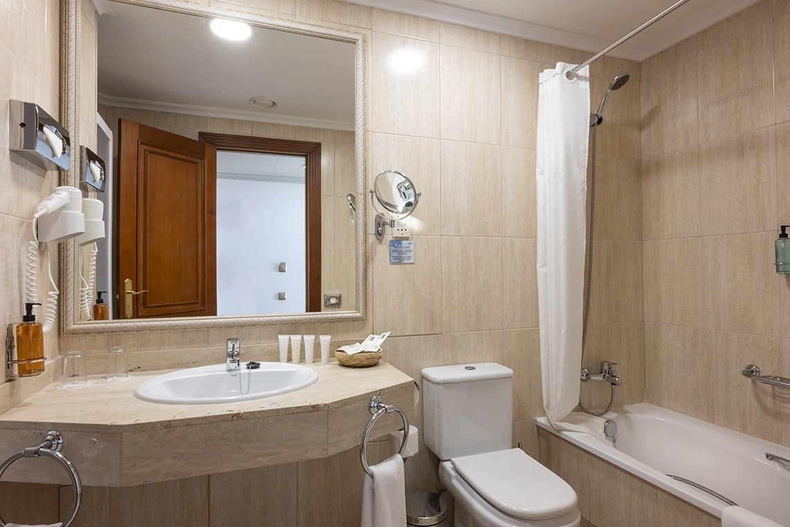 a bathroom with a toilet a sink and a bathtub