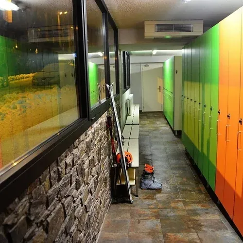 Hotel lockers in vibrant orange and green at Hotel Cristina, Andorra. Book your stay with Estival Group.